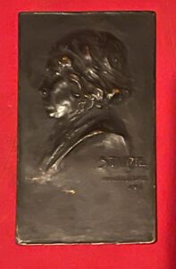 Lowenthal. Artur: a bronze plaque of a youth signed and dated 1901