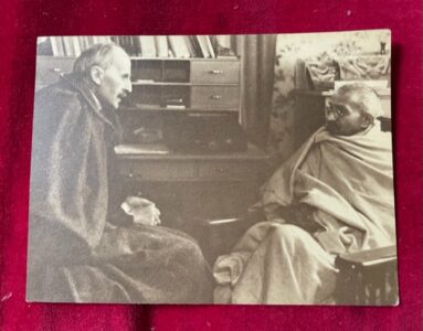 Ghandi. An old photograph of Ghandi in conversation.